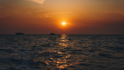 Fishing boat on the shore at sunset.  A beautiful sunset in the background. Croatia, Brijuni Island