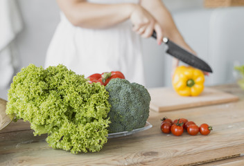 Pregnant woman making a salad