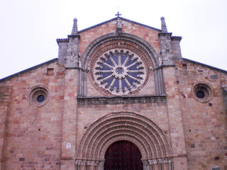 Fototapeta na wymiar Main facade with its rosette of the church of San Pedro Apostol in Avila. February 12, 2010. Avila, Castilla Leon, Europe. Travel Tourism Street Photography