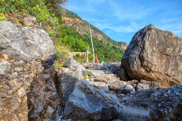 idyllic scene with big rocks on the sea coast 
