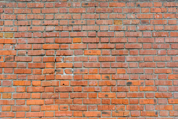 Old brick wall of red color, panorama of masonry. Texture background.