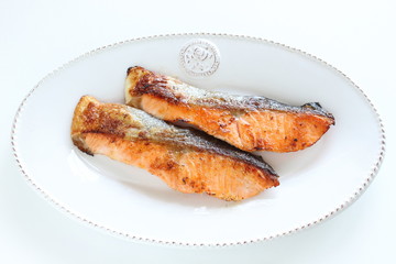 Pan fried salmon fillet fish on dish