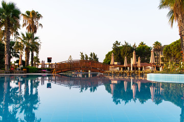 Fototapeta na wymiar View to a pool. Early morning. Summer. Kemer, Turkey.