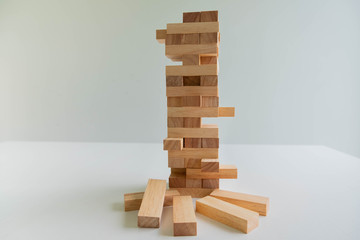 Wood block tower with architecture model, Planning Alternative Risk and Strategy in Business concept