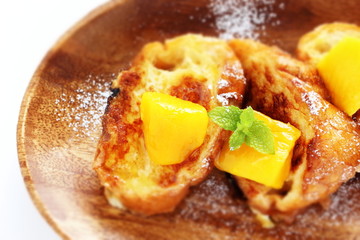 Mango and French toast with mint for gourmet breakfast image