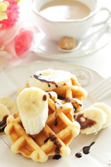 Obraz na płótnie Canvas Belgium waffle and banana for breakfast image