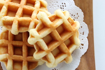 Waffle on wooden plate for gourmet dessert