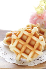 Waffle on wooden plate for gourmet dessert