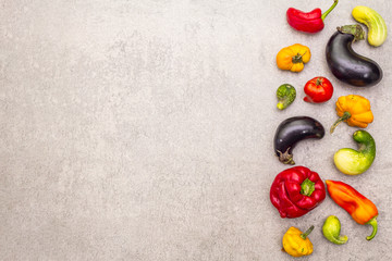 Trendy ugly organic vegetables. Assortment of fresh pepper, eggplant, cucumber, tomato, pumpkin