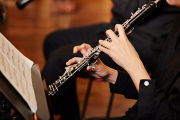Playing the oboe, hands close up 