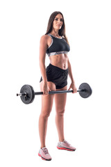 Fototapeta na wymiar Young fitness woman in black top and shorts posing with barbell. Full body isolated on white background. 