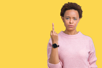 Beautiful young african american woman over isolated background Showing middle finger, impolite and...