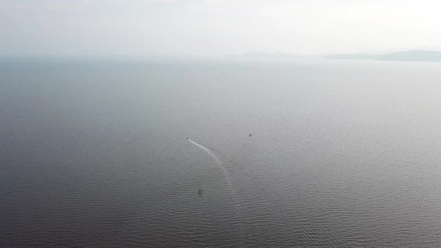 Fishing boat move in the sea during haze day near Kuala Juru, Penang.