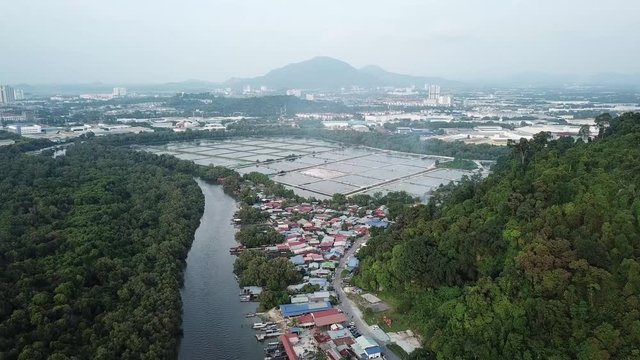 Fly over fish farm and fishign vilalge. Background is Bukit Mertajam Hill.