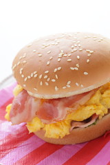 Homemade scrambled egg and bacon burger with copy space