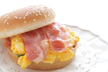 Homemade scrambled egg and bacon burger with copy space