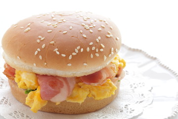 Homemade scrambled egg and bacon burger with copy space