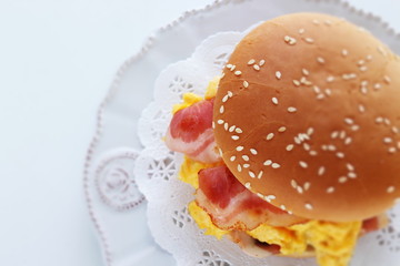 Homemade scrambled egg and bacon burger with copy space