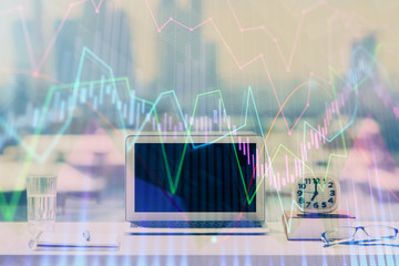 Forex Chart hologram on table with computer background. Multi exposure. Concept of financial markets.