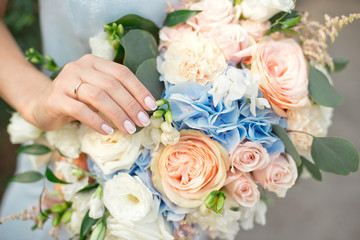 Bride showing off her beautiful boho flowers bouquet chic boho wedding magazines and websites,...