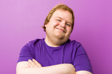 Young authentic redhead fat man laughing and having fun.