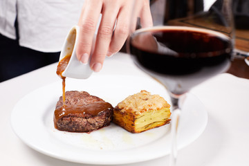 steak with knife and fork on plate