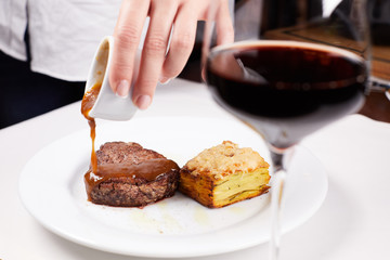 steak on plate with fork and knife