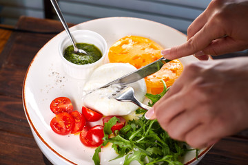woman preparing salad in kitchen