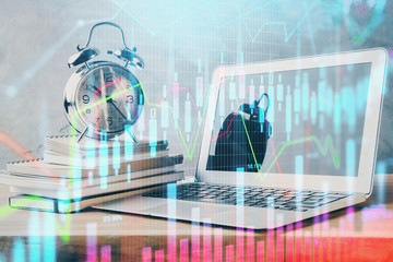 Financial market graph hologram and personal computer on background. Multi exposure. Concept of forex.