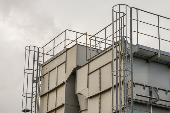 upper part of an industrial building with stairs, railings