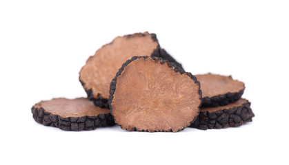 Black truffles isolated on a white background. Fresh sliced truffle. Delicacy exclusive truffle mushroom. Piquant and fragrant French delicacy. Clipping path.