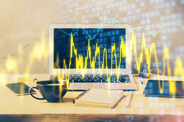 Double exposure of graph and financial info and work space with computer background. Concept of...