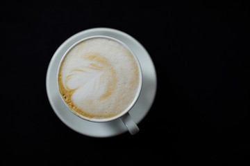 cup of coffee on black background