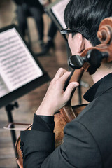 A man playing the violin 