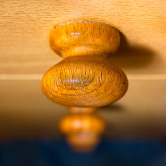Old brown wooden knob with visible wood structure - soft and selective focus