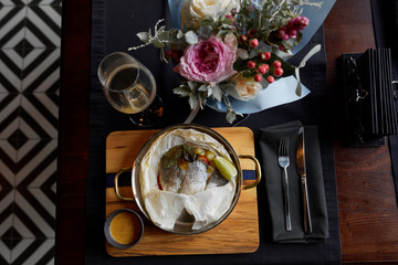 wedding rings and bouquet of roses