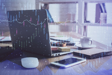 Financial graph colorful drawing and table with computer on background. Double exposure. Concept of international markets.