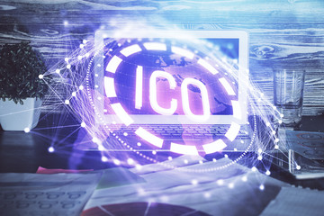 Multi exposure of blockchain theme hologram and table with computer background. Concept of bitcoin crypto currency.