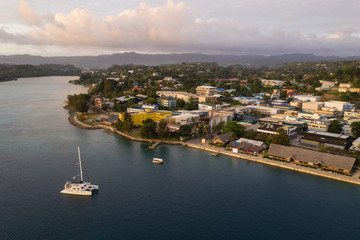 Port Villa waterfront and business district with catamaran in Vanuatu capital city in the south...