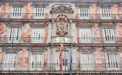 Fototapeta premium Old building with colorful facade on the Plaza Mayor, in a rainy day at Madrid