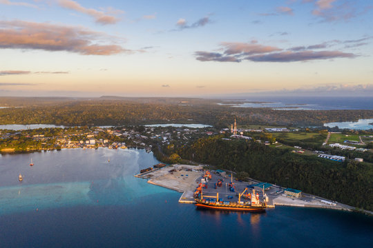Aerial view of a container ship loading cargo in the commercial dock of Port Vila, Vanuatu capital city in the south Pacific
