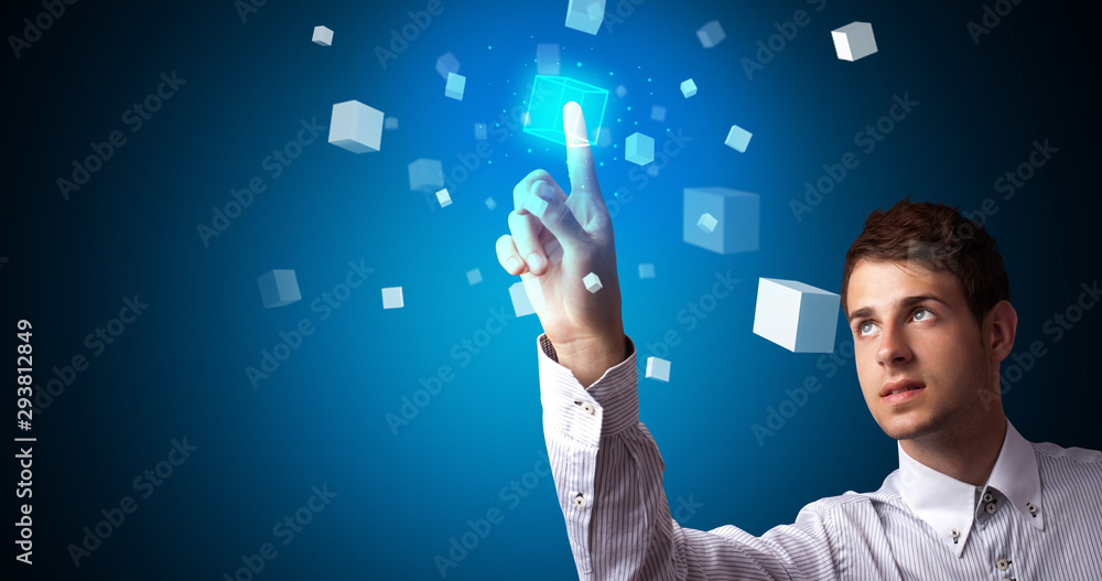 Aufkleber Man touching hologram screen displaying cube symbols