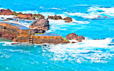 View of a beach with waves in the Spanish town of Puerto de La Cruz in the north of Canary island