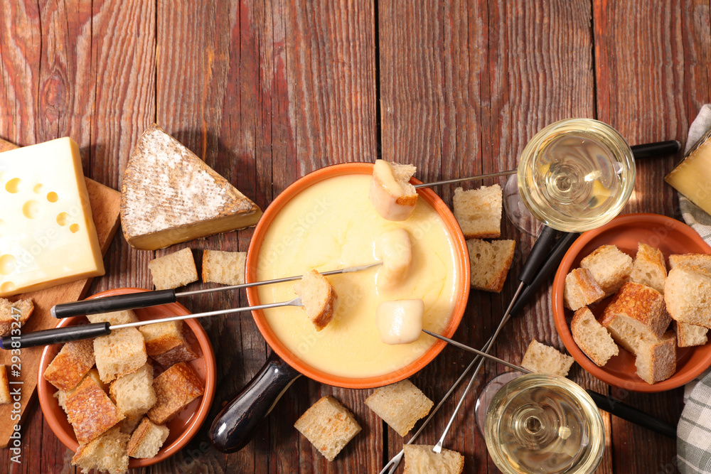 Wall mural cheese fondue with wine and bread- traditional french dish - Wall murals