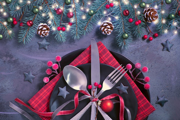 Flat lay with Xmas decorations in green and red on dark, copy-space