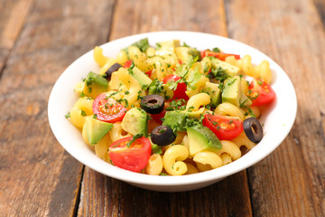 pasta salad with tomato, olive and avocado