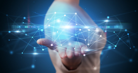 Handsome person holding hologram screen displaying modern cloud based web system technology