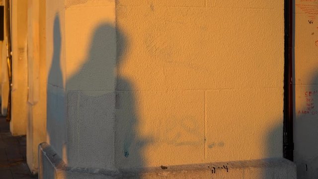 Shadows of the people on a wall