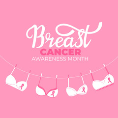 National Breast Cancer Awareness Month banner. Pink bras hanging on a rope