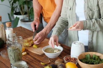 Young married couple is preparing a smoothie